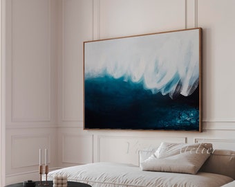 May include: A modern living room with a white couch and a black coffee table. A large abstract painting with blue and white brushstrokes hangs on the wall.