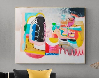 May include: Abstract art painting with a gold frame. The artwork features a colorful composition of shapes and forms in shades of pink, yellow, blue, and black. The painting hangs above a black sofa with a yellow pillow.