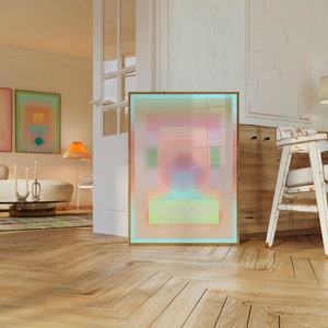 May include: Abstract art print with a pink, blue, and green color scheme. The print is framed in a light wood frame and is hanging on a white wall.