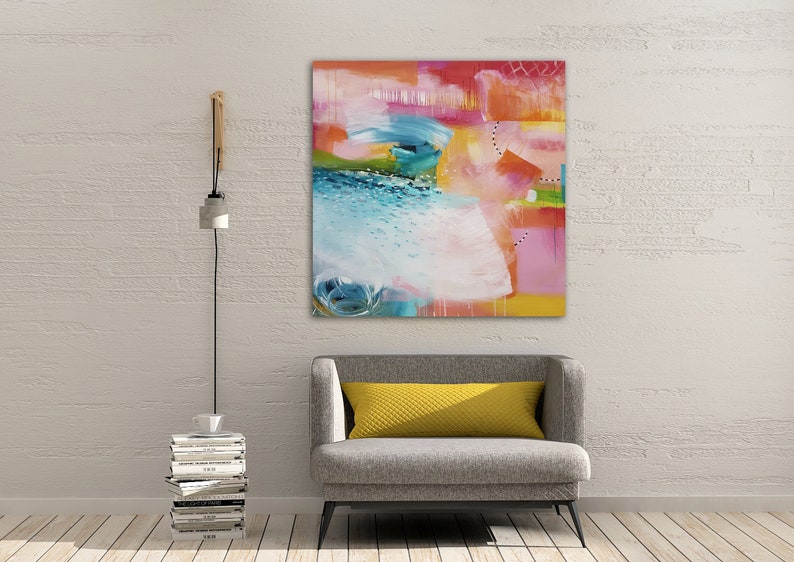 May include: Abstract painting with bright colors, including pink, yellow, blue, and green. The painting has a textured look and is framed in a white frame.