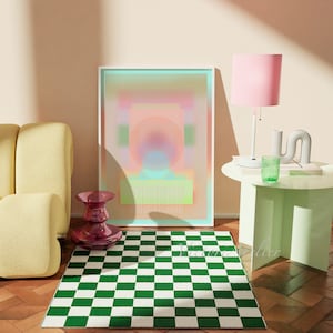May include: A green and white checkered rug in front of a yellow couch, a pink lamp, and a framed abstract art print with a pink, blue, and green color scheme.