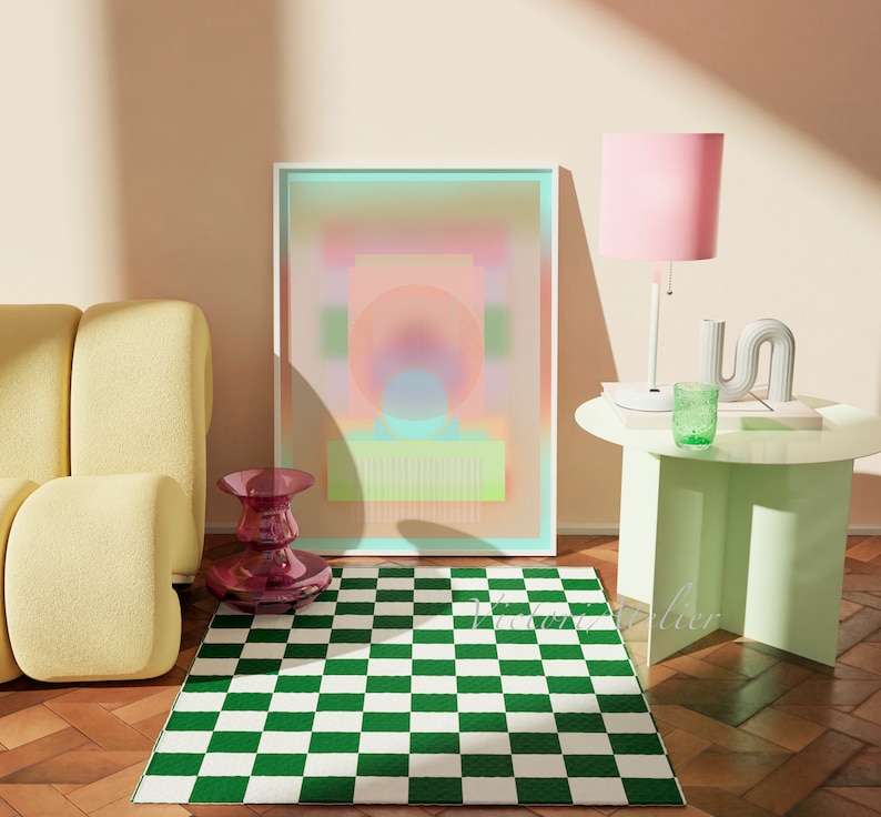 May include: A green and white checkered rug in front of a yellow couch, a pink lamp, and a framed abstract art print with a pink, blue, and green color scheme.