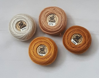 4 balls of "Vog" Cotton Perle No. 8 in Beige-Brown shades No. 348, 349, 372, ECRU