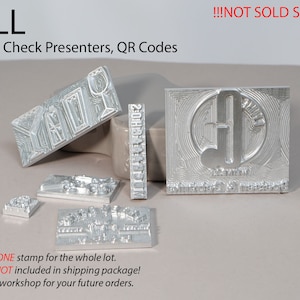 May include: A set of metal stamps for creating custom coasters, check presenters, and QR codes. The stamps are silver and have various designs, including a musical note, a glass of wine, and a geometric pattern. The text "SMALL" and "NOT SOLD SEPARATELY!" is visible in the image.