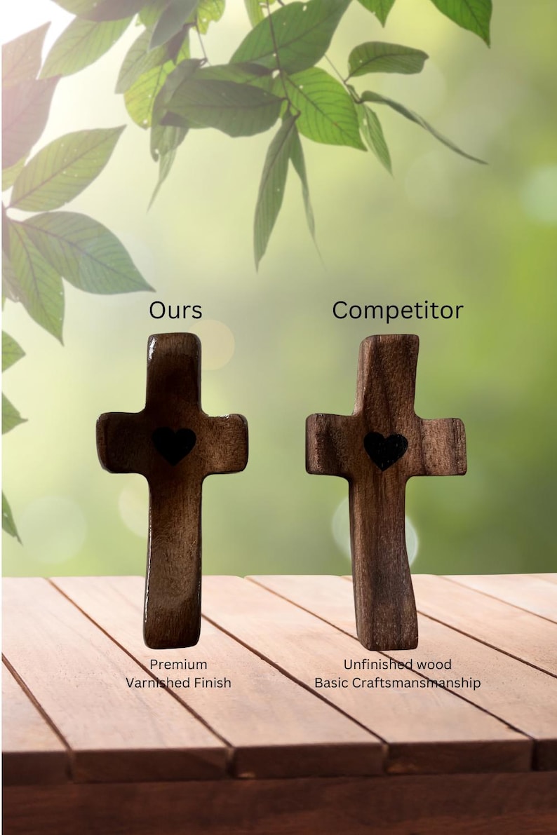 May include: Two wooden crosses with heart cutouts are displayed. The left cross has a premium varnished finish, while the right cross is unfinished. The text "Ours" and "Competitor" are above the crosses.