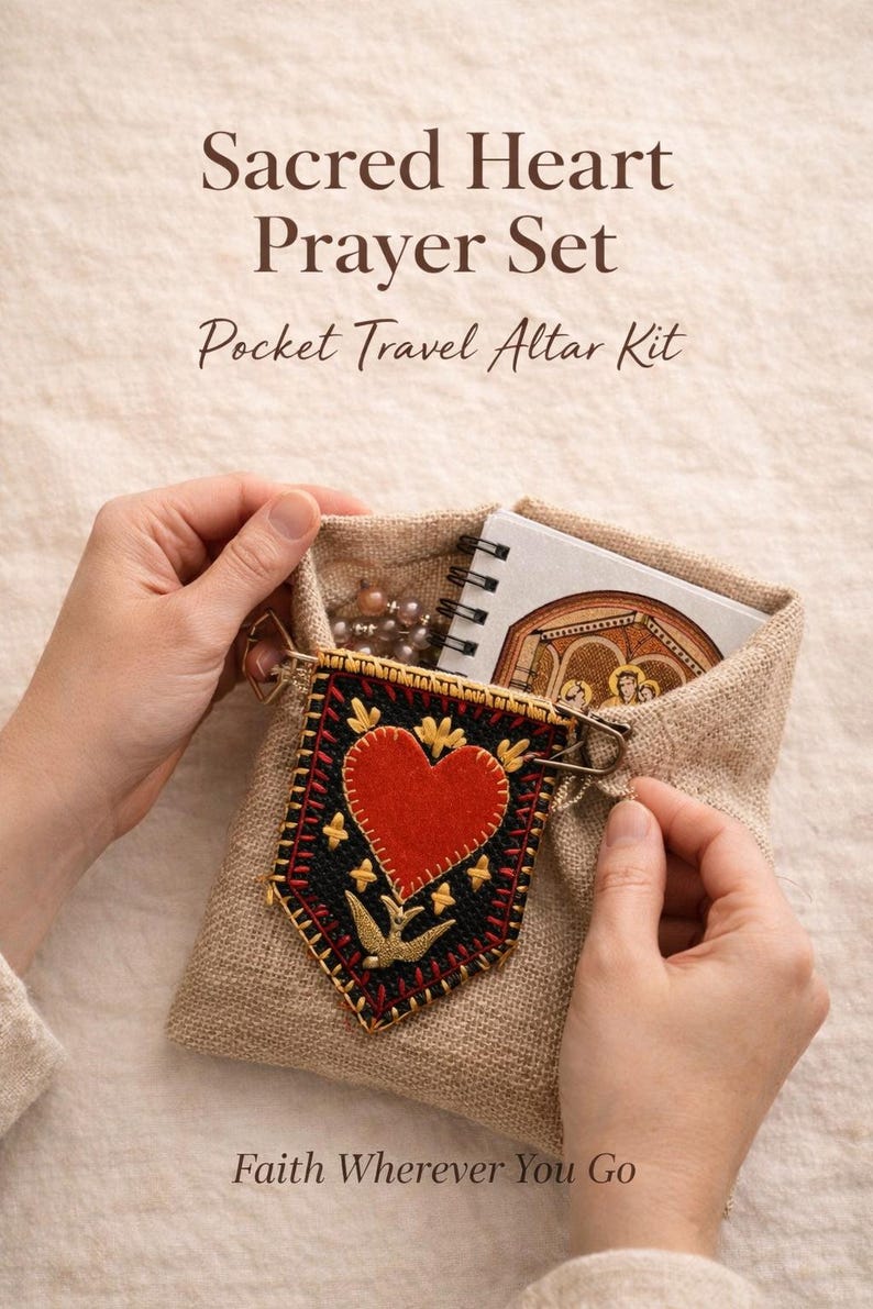 May include: A linen pouch containing a Sacred Heart Prayer Set, a Pocket Travel Altar Kit. The kit includes a small notebook, rosary beads, and a decorative banner with a red heart and gold accents. Text on the image reads "Faith Wherever You Go."