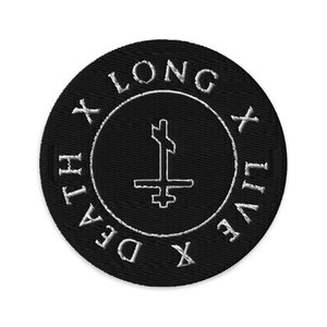 May include: Black and white embroidered patch with a circle design. The circle has the text "X LONG X LIVE X DEATH" around the edge and a stylized inverted cross in the center.