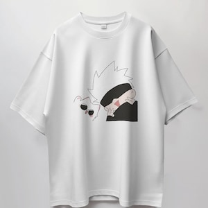 May include: White t-shirt with a black and white cartoon illustration of a character with spiky white hair wearing a black eye mask and a white cat with black sunglasses.