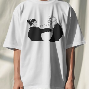 May include: White t-shirt with a black and white illustration of two people facing each other. The text "さよなら" is printed on the shirt.