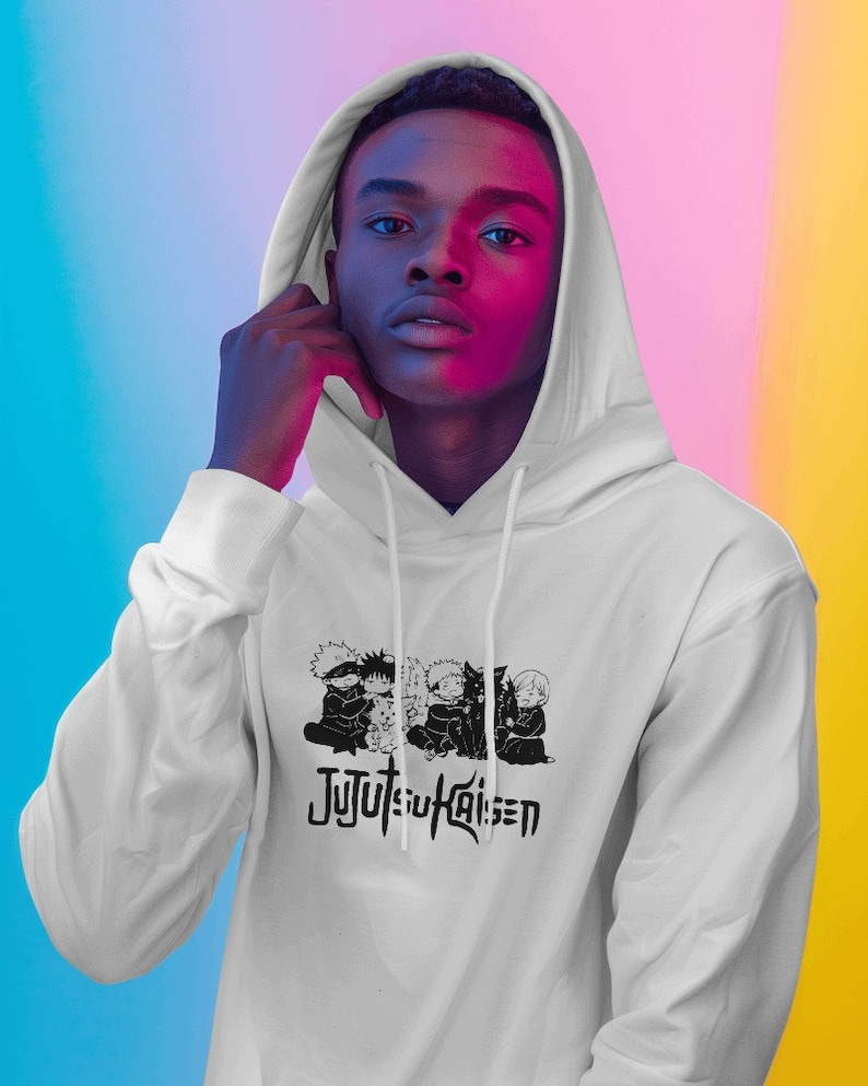 May include: White hooded sweatshirt with a black and white graphic print of characters from the anime Jujutsu Kaisen. The characters are in a group hug and the text "Jujutsu Kaisen" is printed below them.