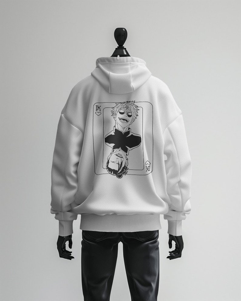 May include: White hoodie with a black and white illustration of a playing card with a man's face on it. The card is the King of Hearts.
