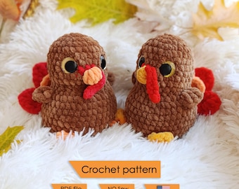 May include: Two handmade brown crochet turkey figurines with red, orange, and yellow accents. The turkeys have large black eyes and are positioned on a white, fluffy surface. The image includes text that reads "Crochet pattern".