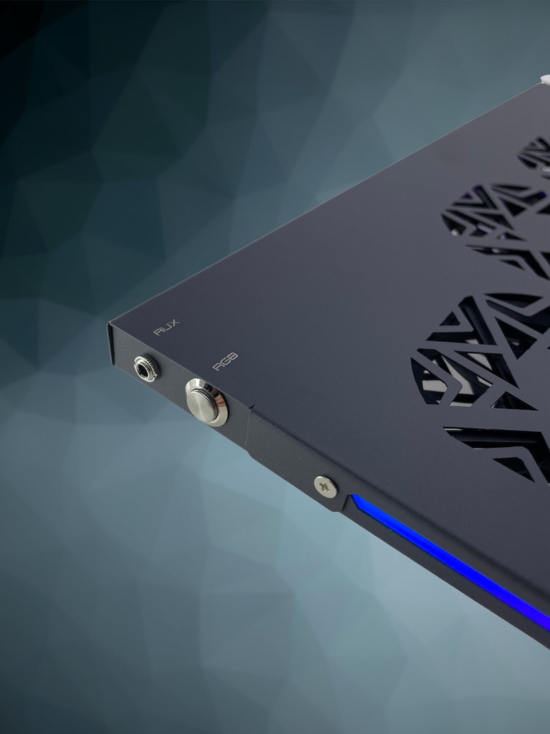 May include: A black metal computer case with a blue LED light strip along the bottom edge. The case has a cutout design on the side and features a power button and a USB port labeled "USB".