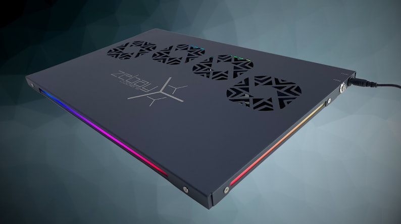 May include: A black laptop cooling pad with a Zealou logo and three circular fan vents. The pad has a multi-colored LED light strip along the edge.