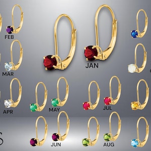 May include: Twelve pairs of gold hoop earrings with a gemstone in each hoop. The gemstones are different colors, representing each month of the year.  The earrings are labeled with the months: January, February, March, April, May, June, July, August, September, October, November, and December.
