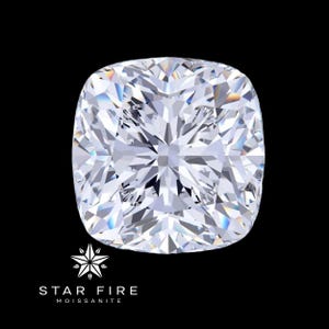 May include: A large, clear, cushion-cut gemstone with a starburst pattern. The gemstone is set against a black background. The text "STAR FIRE MOISSANITE" is below the gemstone.