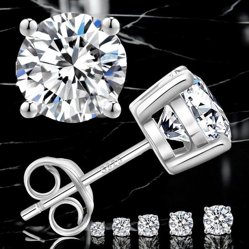 May include: A set of silver stud earrings with clear cubic zirconia stones. The earrings come in five different sizes.