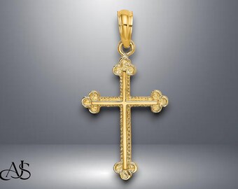 Könnte beinhalten: Goldfarbener Anhänger in Form eines Kreuzes. Das Kreuz hat aufwendige Details und eine Schlaufe für eine Kette. Das Design zeigt ein klassisches christliches Symbol, geeignet für religiösen Schmuck.