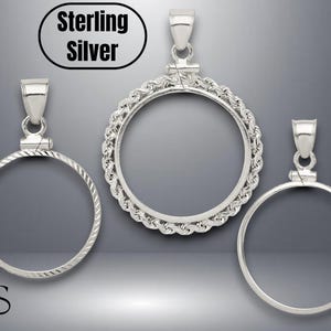 May include: Three sterling silver coin bezel pendants. The pendants have different designs: a smooth, a rope-like, and a textured edge. The text "Sterling Silver" is in a black oval at the top. Each pendant has a loop for a chain.