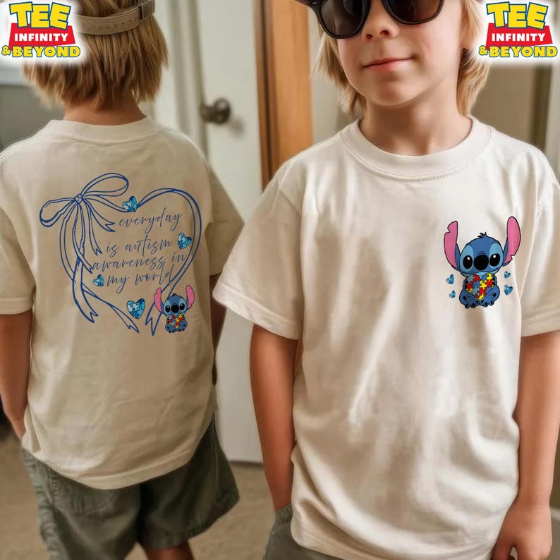 May include: Off-white t-shirts featuring a cartoon Stitch character with an autism awareness puzzle piece design. One shirt has the text "everyday is autism awareness in my world" with a blue bow and heart design.
