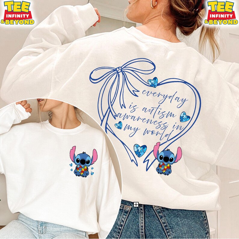 May include: White sweatshirt featuring a blue Stitch graphic with an autism awareness puzzle piece design. The back of the sweatshirt has a blue heart with the text "everyday is autism awareness in my world".