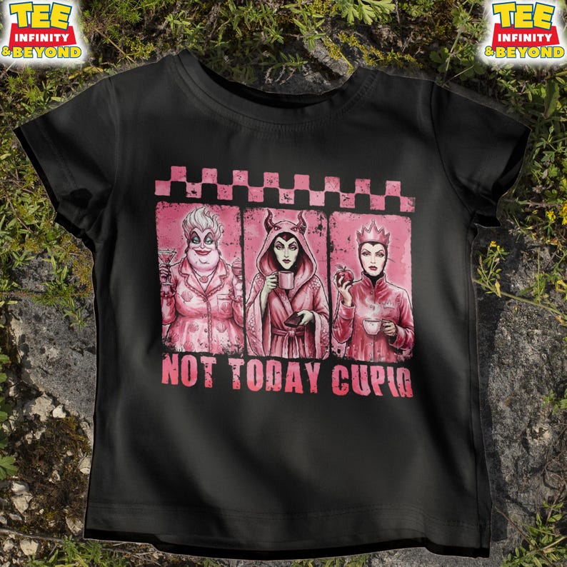 May include: Black t-shirt featuring a pink graphic of three cartoon villains with the text "NOT TODAY CUPID". The graphic includes Ursula, Maleficent, and the Evil Queen. The shirt has short sleeves and a crew neck.