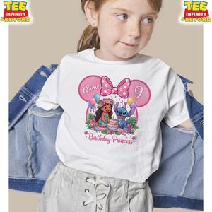 May include: White t-shirt featuring a pink Minnie Mouse-inspired design with a bow, the number 9, and the words "Birthday Princess." The graphic includes cartoon characters and a cake. The shirt is worn by a young girl.