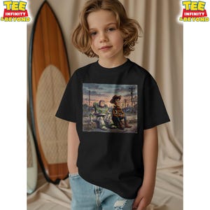 May include: Black t-shirt with a graphic of Buzz Lightyear and Woody from Toy Story. The illustration has a vintage style. The shirt has the text "TEE INFINITY & BEYOND" on the upper left. The characters are sitting together.