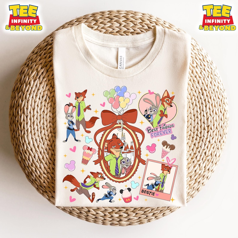 Puede incluir: Una camiseta de color crema con una ilustraci&oacute;n de dibujos animados de dos personajes animales, un zorro y un conejo. Los personajes se representan en varias poses, incluyendo sosteniendo globos, usando gafas de sol y de pie frente a un castillo. El texto "Best Friends Forever" y "Bestie" tambi&eacute;n se incluye en el dise&ntilde;o.