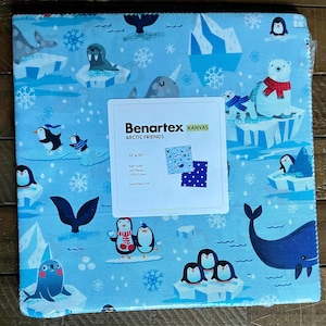 May include: A square fabric panel with a light blue background featuring arctic animals like penguins, polar bears, and whales. The fabric is printed with icebergs and snowflakes. A white label reads "Benartex KANVAS ARCTIC FRIENDS 10" x 10" .