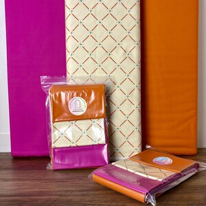 May include: A set of three ceramic mugs with a speckled, matte finish. The mugs are in shades of cream, light gray, and dark gray. Each mug has a simple, minimalist design and a rounded handle.