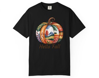 May include: Black t-shirt featuring a watercolor pumpkin design with autumn colors and the text "Hello Fall". The pumpkin has a variety of patterns and textures, including leaves, mountains, and geometric shapes.