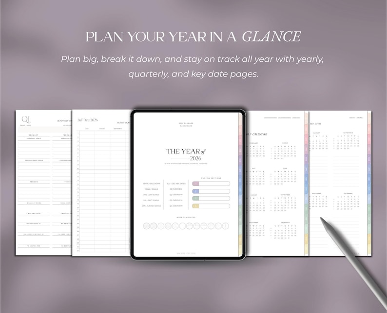 May include: A digital planner with the text "PLAN YOUR YEAR IN A GLANCE". The planner includes yearly, quarterly, and key date pages. The central page displays "THE YEAR of 2026" with a calendar and progress bars. A stylus rests on the right side.
