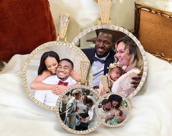 May include: Four gold-tone pendants with clear rhinestones surrounding a photo of a family. The pendants are connected by a gold chain.
