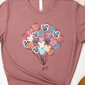 a t - shirt with a bunch of flowers on it