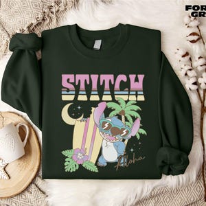 a green sweater with a cartoon character on it