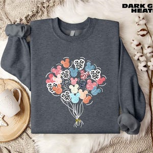 a sweater with a bunch of flowers on it