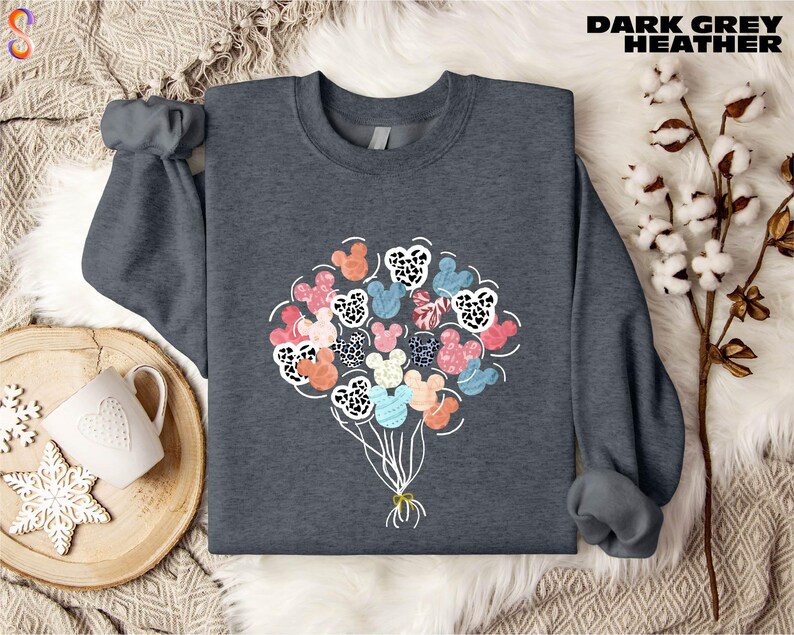 a sweater with a bunch of flowers on it