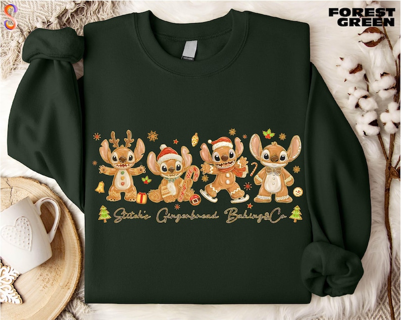 A green sweater with a Christmas-themed design featuring four cartoon characters, including Stitchie, Gingerbread, Baking, and Stitchie, along with the text "Stitchie, Gingerbread, Baking, Stitchie".
