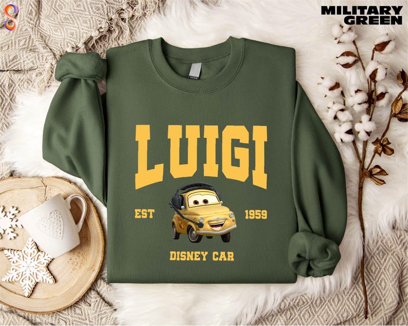 a green sweatshirt with a yellow car on it