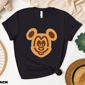 a t - shirt with a bear face on it
