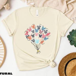 a t - shirt with a bunch of flowers on it