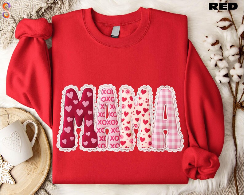 A red sweatshirt with the word "Mama" printed on it, surrounded by decorative heart shapes in various colors.