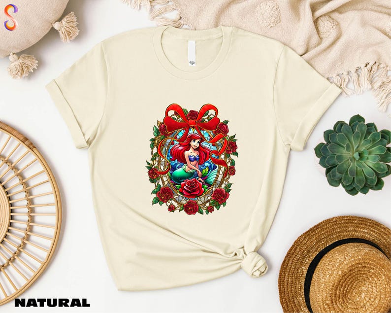 a t - shirt with a picture of a mermaid on it
