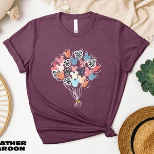 a t - shirt with a bunch of flowers on it