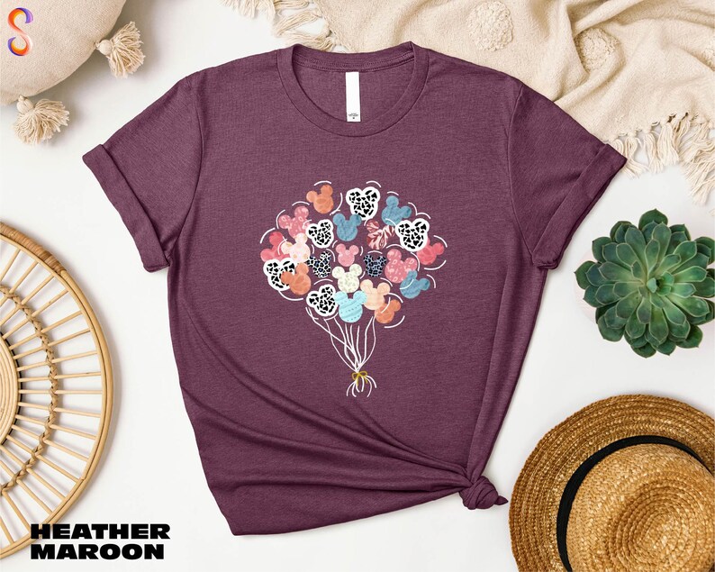 a t - shirt with a bunch of flowers on it