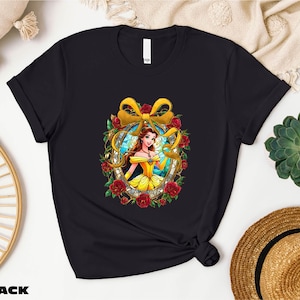 a black t - shirt with a picture of snow white and roses on it