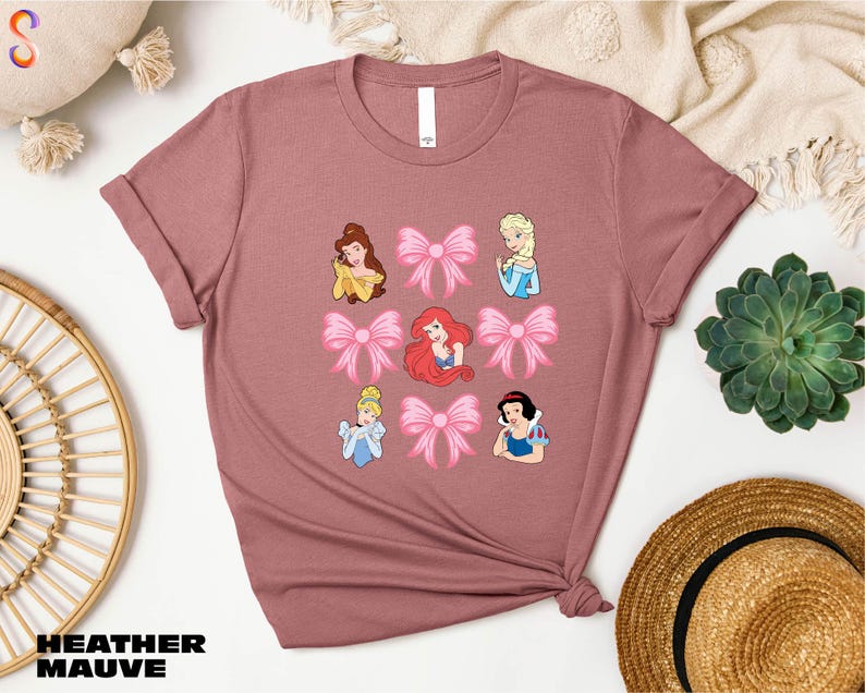 a t - shirt with a picture of princesses on it