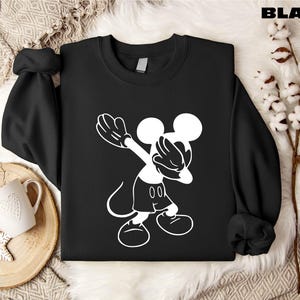 a black shirt with a white mickey mouse on it