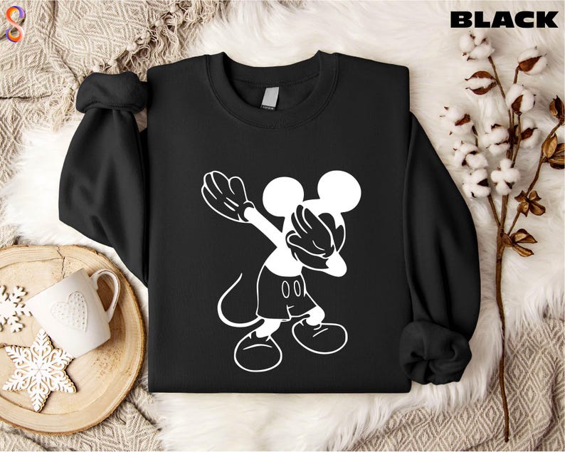 a black shirt with a white mickey mouse on it